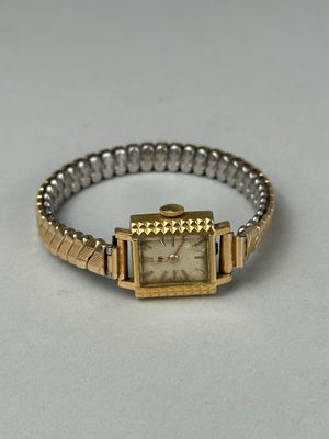 an image of a wrist watch on a white surface