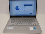 a laptop that is sitting on a white table