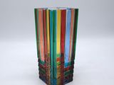 multicolored glass vase on a white surface with a white background