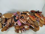 a pile of shoes that are sitting on the floor