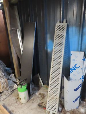 several pieces of metal are stacked on top of each other in a room