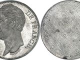 a close up of a coin with a woman ' s face on it