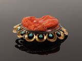 an image of a red coral and turquoise stone broochle