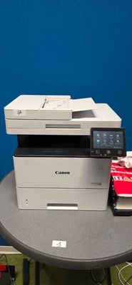 a photo of a printer on a table in a room
