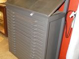 a gray cabinet with drawers in the corner of a room