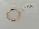 a gold ring on a white background with a price tag