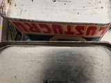 two tins that are sitting on top of each other