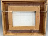 an old picture of a picture frame in a box on a table