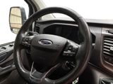 a steering wheel and dashboard of a car in a vehicle