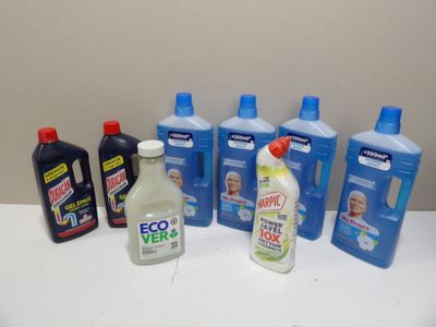 many bottles of cleaning products sitting on a counter