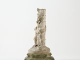 an antique statue of a dog and a cat on a pedestal