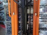 a forklift with a fork on top of it in a warehouse