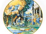 an image of a plate with a painting of a biblical scene on it