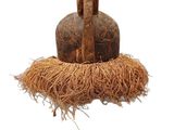 a small bird that is sitting on top of a piece of straw