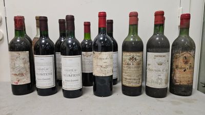 several bottles of wine are lined up on a counter