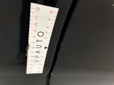 a measuring tape on the side of a black car