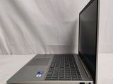 an open laptop computer sitting on top of a white table