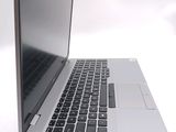 a close up of a laptop computer on a white surface