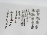 a lot of small toy figurines that are on the table