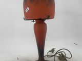 a lamp that is sitting on the ground in the snow