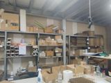 a room filled with lots of boxes and shelves