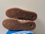 a pair of shoes sitting on top of a blue box