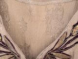 an image of a close up of a dress with flowers on it