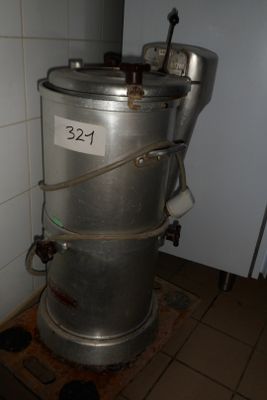 an image of a stainless steel barrel on the floor