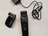 an image of a hair clipper and a charger on a table
