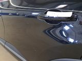a sticker on the door handle of a car