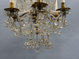 a chandelier that has a lot of crystal hanging from it