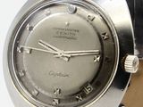a silver watch with roman numerals on the face