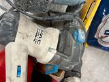 a picture of a corded sander and other tools sitting on a table