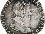une pièce d'argent portant l'image d'un homme