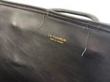 a black bag that is sitting on a table