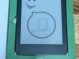 a kindle that is in the box on the table