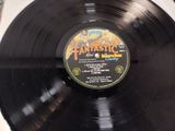 an image of a black vinyl record with a picture on it
