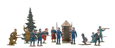 a lot of figurines that are on a white surface