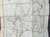 an old map on a piece of paper with a compass on it