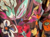 a close up of a dress with flowers on it