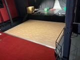 a large wooden floor in the middle of a room