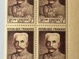 four stamps with a picture of a man and a woman on them