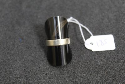 a ring that is sitting on a table next to a price tag