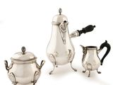 three pieces of silver tea and coffee set on a white background