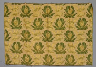 une image représentant un tissu jaune et vert orné d'un motif floral