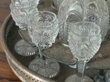 a silver tray with glasses and a pitcher on top of it