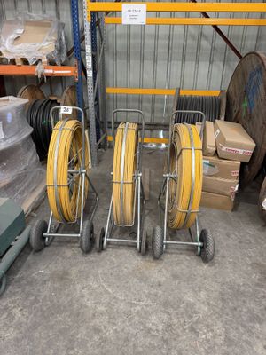 a lot of hoses and carts in a warehouse