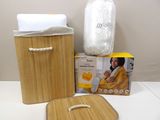a bamboo basket with a towel, soap, and other items on a table