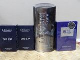 two boxes of perfume and a canister of cologne sitting on a table