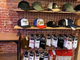 many hats on the shelves in this store
